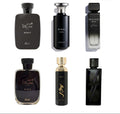 Collection of black perfume bottles with visible branding on a white background
